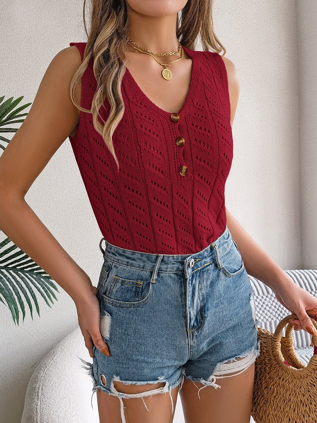 Pull élégant pour femme en maille ajourée avec boutons décoratifs de berg-feldt