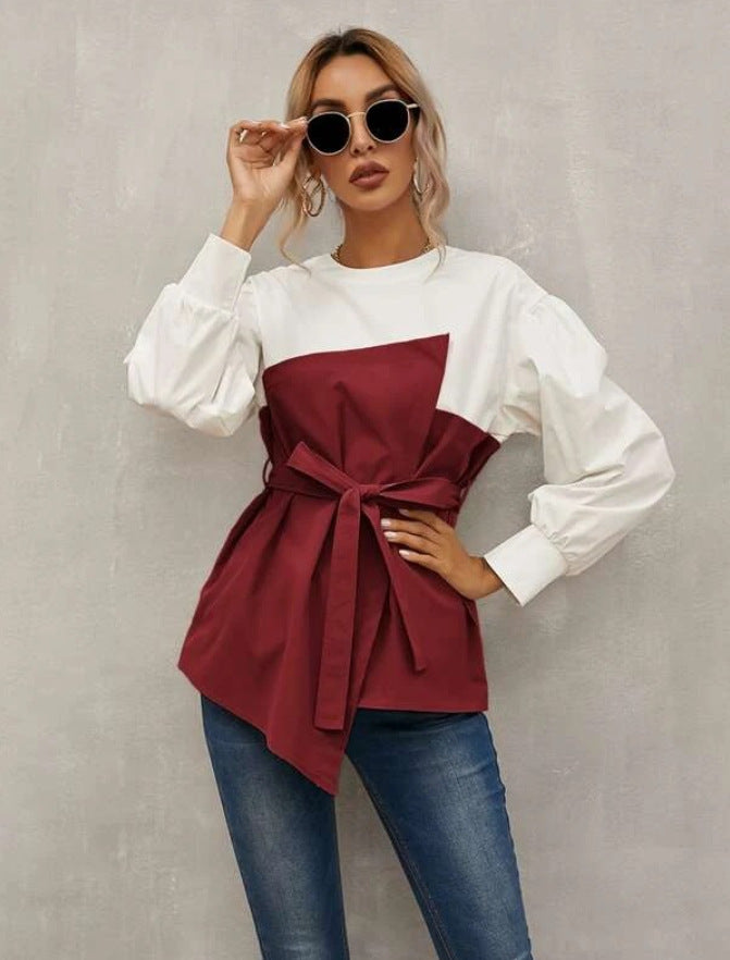 Elegante Damenbluse mit asymmetrischem Schnitt und modischem Gürtel von berg-feldt