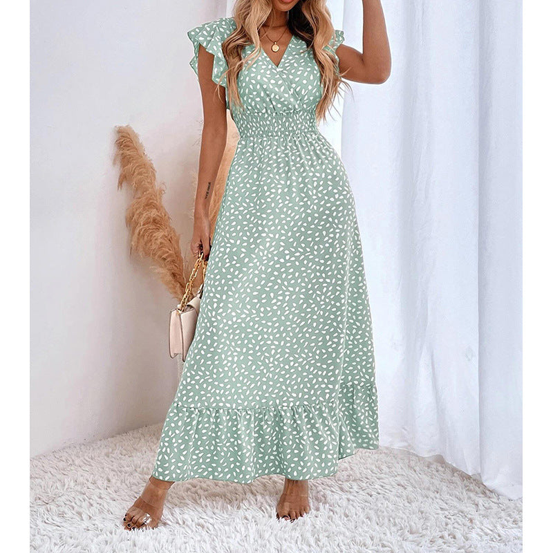 Élégante robe longue berg-feldt avec manches volantées larges et ourlet à volants