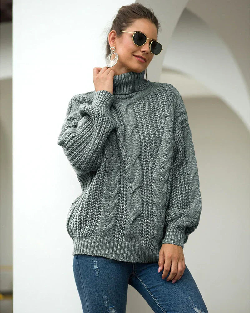 Pull roulé en maille par Elvin