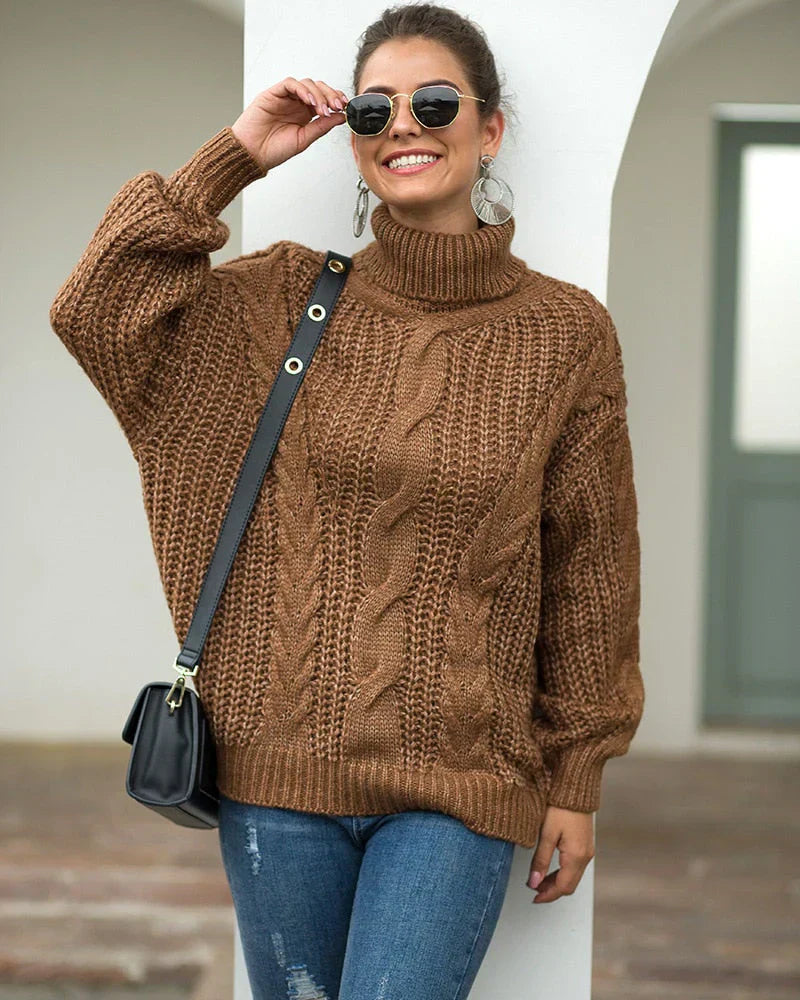 Pull roulé en maille par Elvin