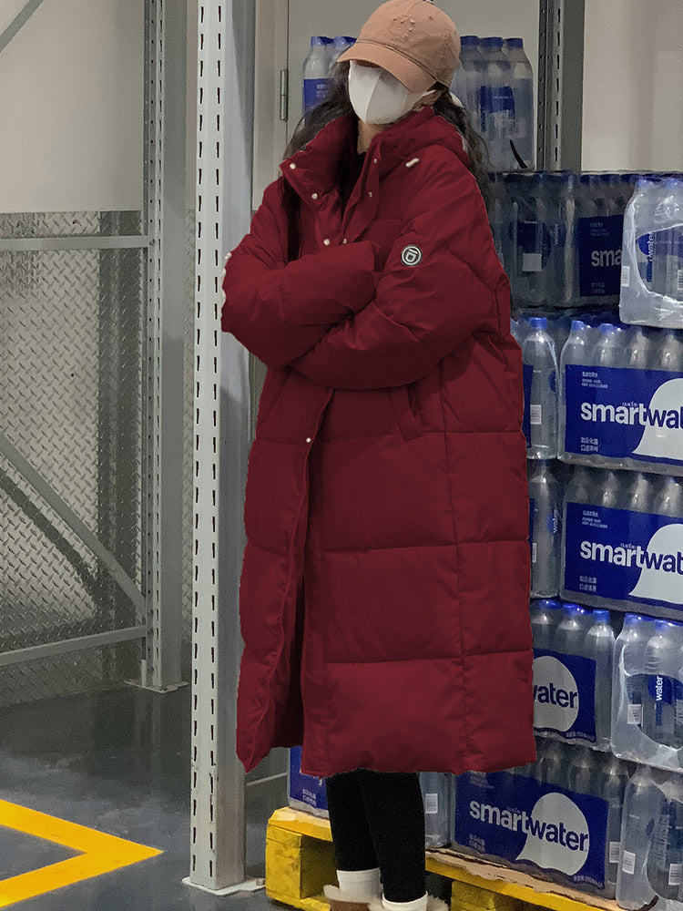 Damenlange Steppjacke mit Kapuze und hohem Kragen Berg-Feldt