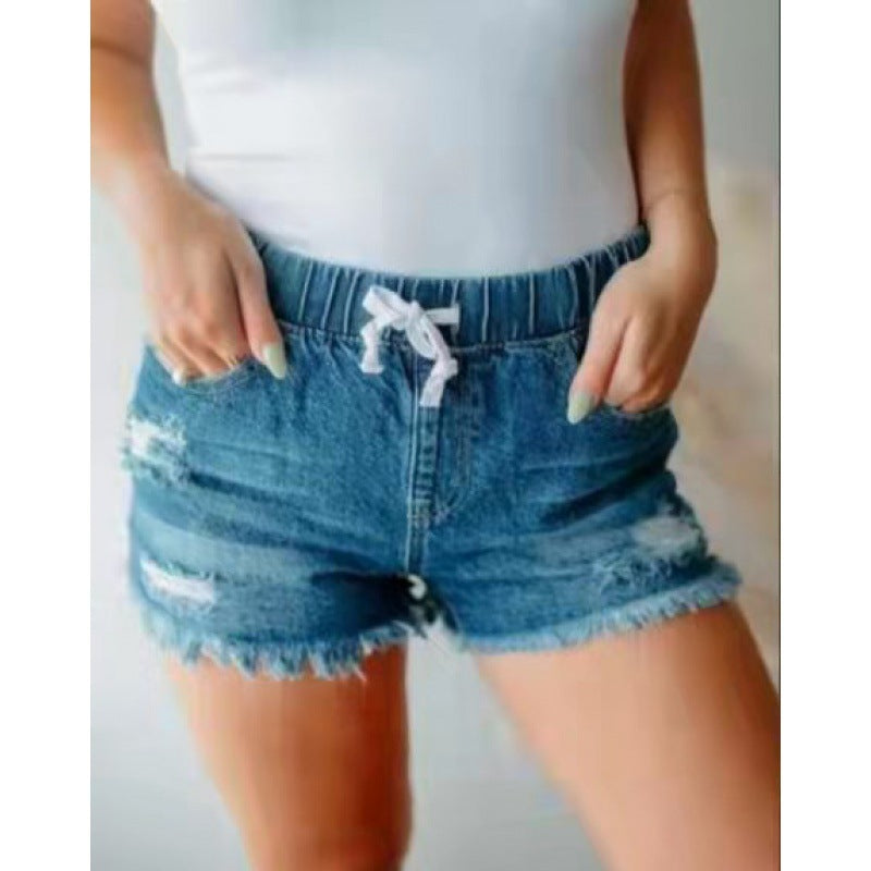 Women's High-Waisted Distressed Denim Shorts with Adjustable Waistband by berg-feldt