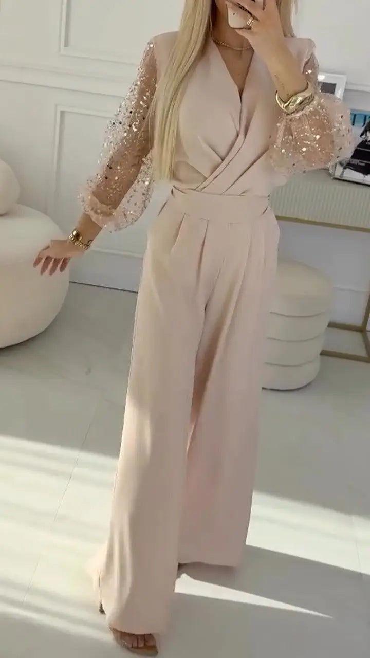Eleganter Damen-Jumpsuit mit Wickeloptik und glitzernden Ärmeln von berg-feldt