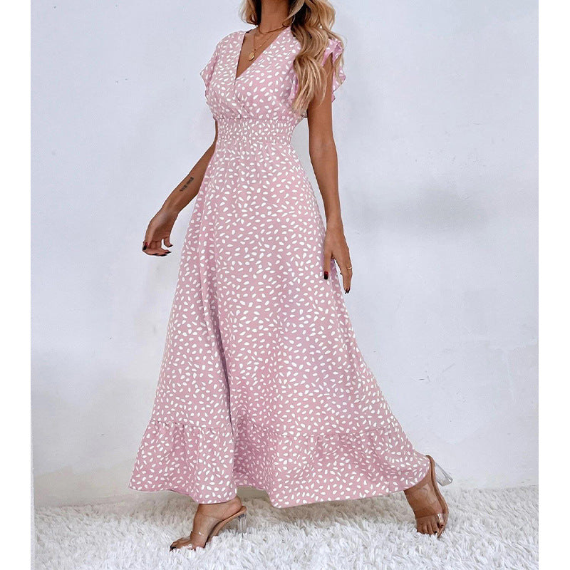 Élégante robe longue berg-feldt avec manches volantées larges et ourlet à volants
