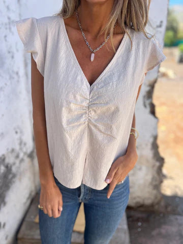 Chemise en coton et lin à col en V : confortable et pliée par Fudus