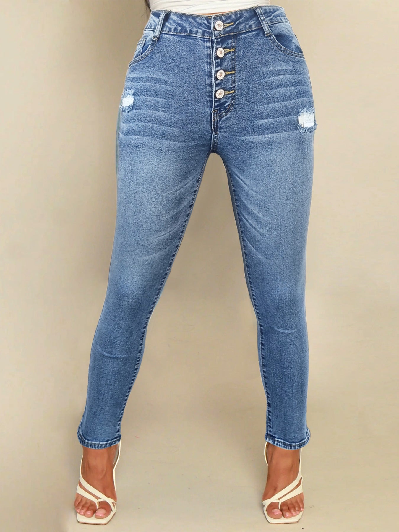 Jean femme Berg-Feldt : coupe skinny, taille haute, boutons fantaisie, look usé décontracté